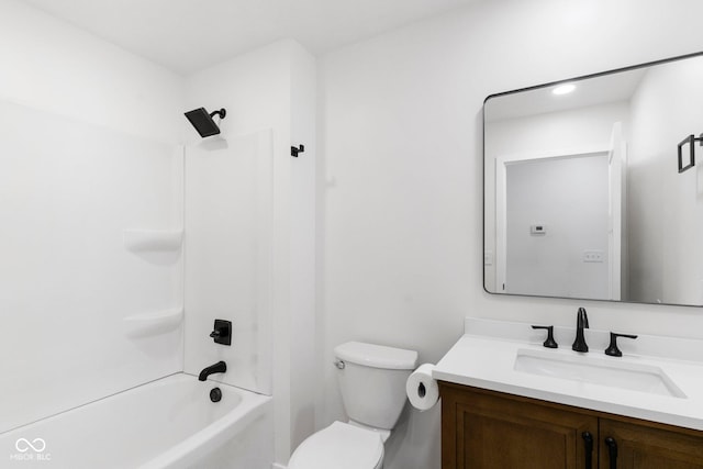 full bathroom featuring vanity, bathtub / shower combination, and toilet