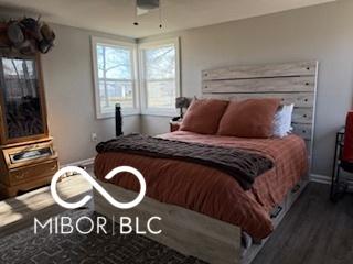 bedroom featuring dark hardwood / wood-style floors and ceiling fan