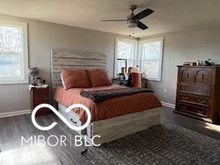 bedroom with ceiling fan and dark hardwood / wood-style floors