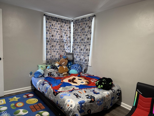 bedroom with hardwood / wood-style floors