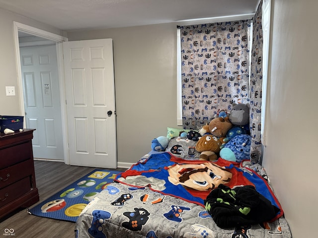 bedroom featuring dark wood-type flooring