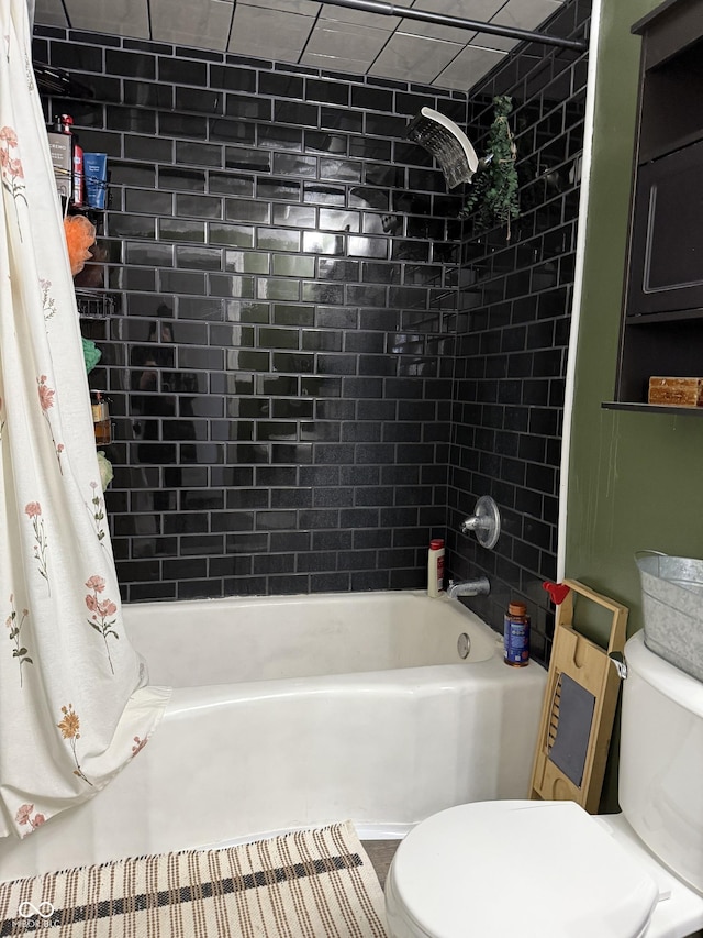 bathroom featuring toilet and shower / bathtub combination with curtain