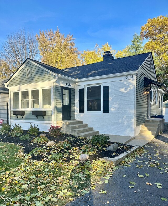 view of front of property featuring a sunroom