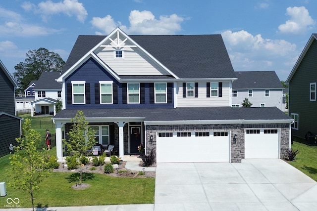 view of front facade featuring a garage and a front lawn