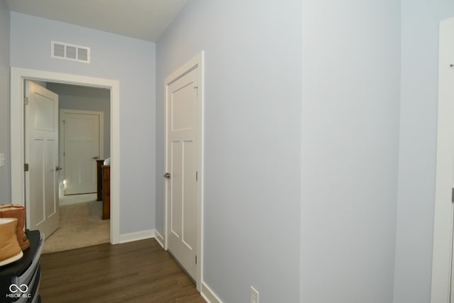 hall featuring dark wood-type flooring