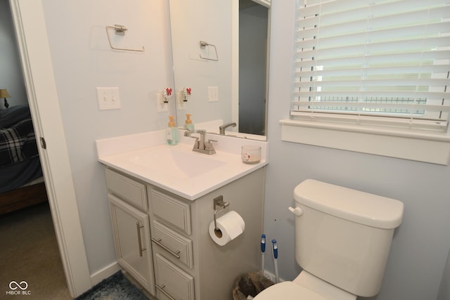 bathroom with vanity and toilet