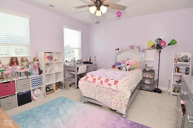 bedroom featuring light colored carpet and ceiling fan