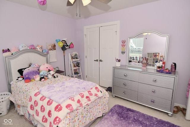 bedroom with light carpet, a closet, and ceiling fan