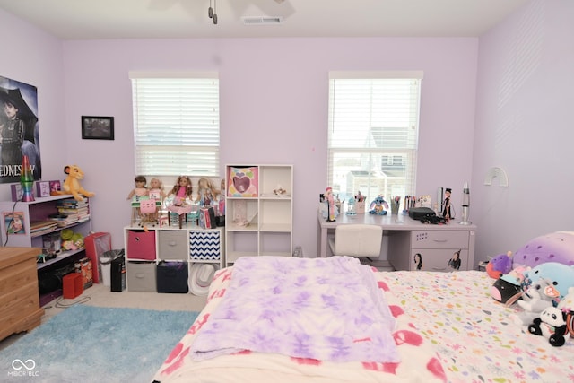 bedroom featuring light colored carpet