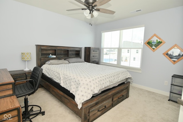 bedroom featuring light carpet and ceiling fan