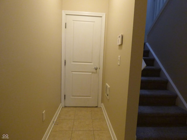 corridor featuring light tile patterned flooring