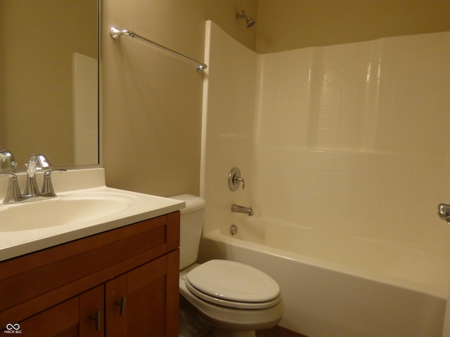 full bathroom featuring vanity, toilet, and  shower combination