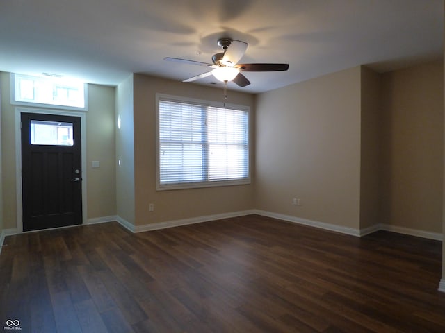 entryway with dark hardwood / wood-style flooring and ceiling fan