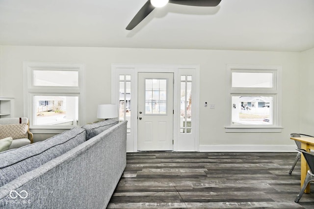 foyer entrance with ceiling fan and dark hardwood / wood-style flooring