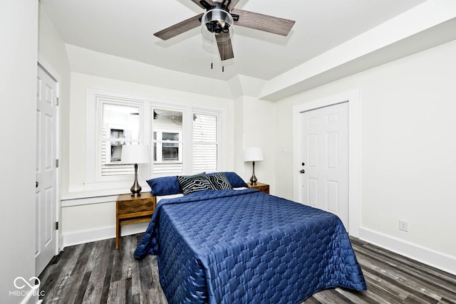 bedroom featuring ceiling fan and dark wood-type flooring