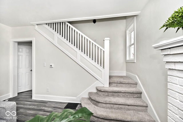 stairway with wood-type flooring