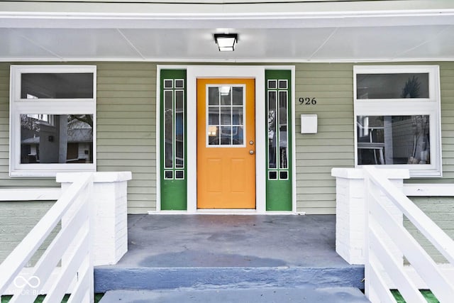 view of exterior entry with covered porch