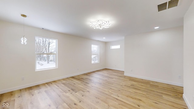 unfurnished room featuring light hardwood / wood-style flooring