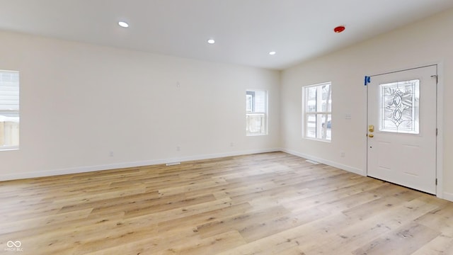 foyer with light wood-type flooring