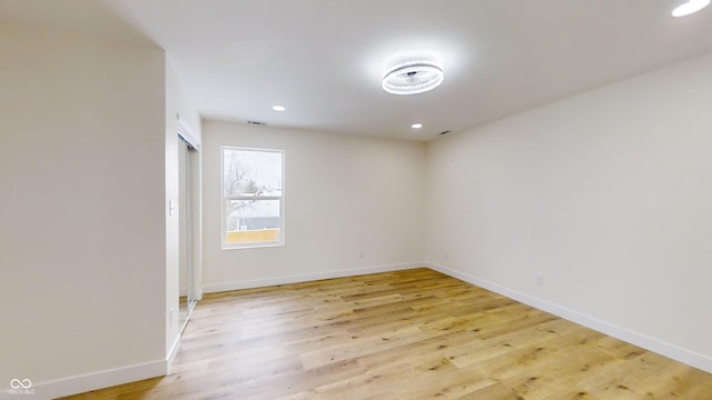 unfurnished room featuring light hardwood / wood-style floors