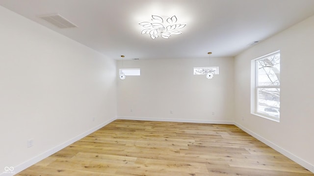 spare room featuring light hardwood / wood-style floors