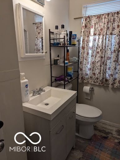 bathroom featuring vanity and toilet