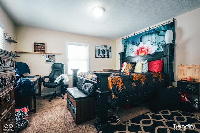 bedroom with multiple windows, carpet, and a textured ceiling