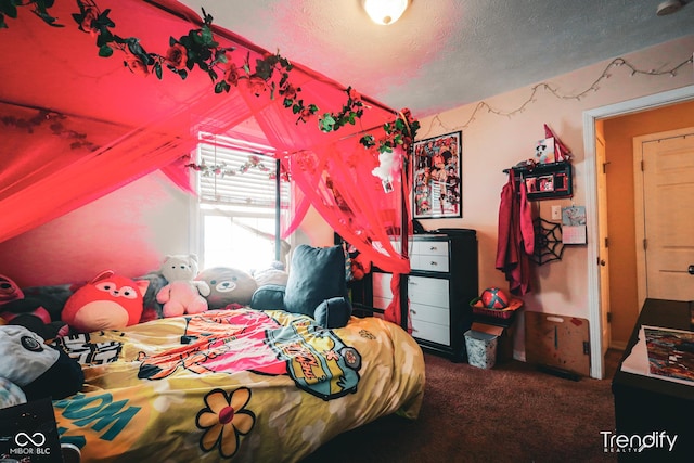 carpeted bedroom featuring a textured ceiling