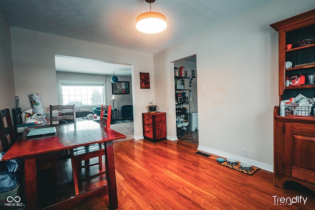 dining room featuring wood-type flooring