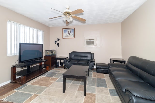 living room with ceiling fan, a wall mounted AC, and hardwood / wood-style floors