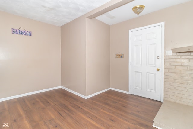 spare room featuring dark hardwood / wood-style floors