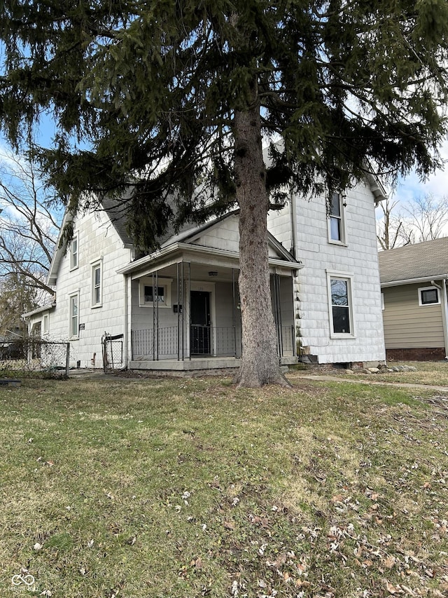 view of front of home featuring a front lawn and covered porch