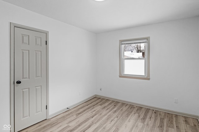 unfurnished room with light hardwood / wood-style flooring