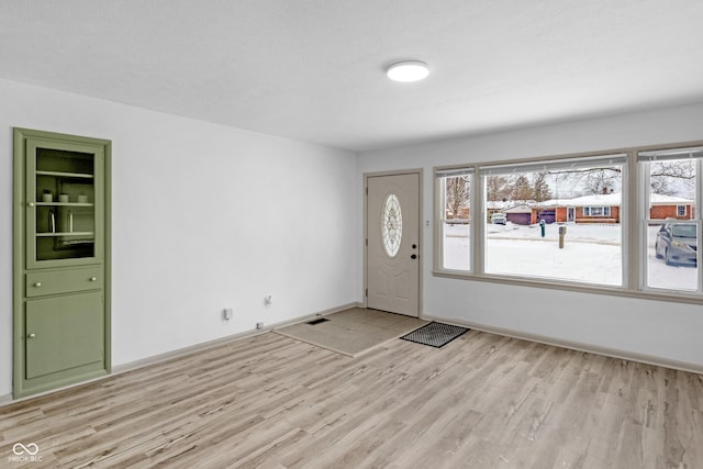 entrance foyer with light hardwood / wood-style flooring