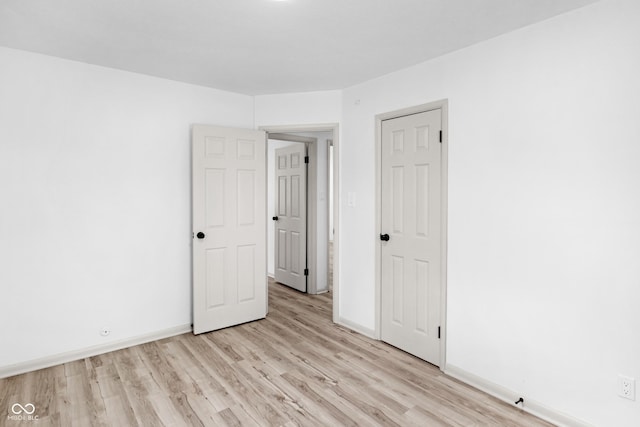 spare room featuring light hardwood / wood-style floors