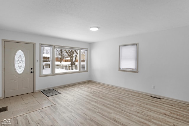 entrance foyer with light hardwood / wood-style floors