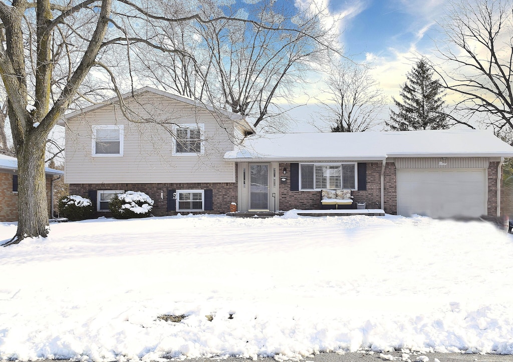 split level home featuring a garage