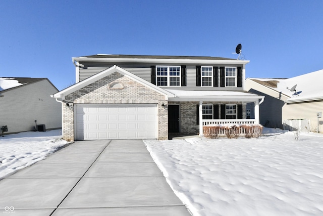 view of front of property featuring a garage and covered porch