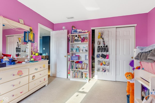 bedroom featuring a closet and carpet flooring