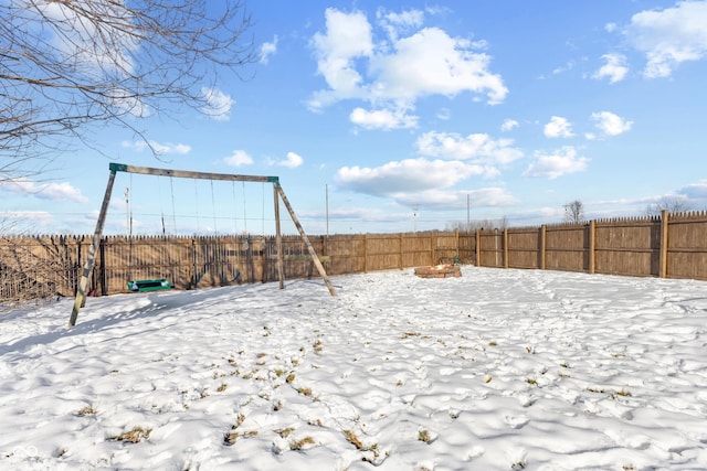 view of yard covered in snow