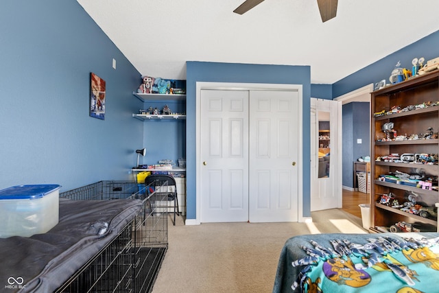 bedroom with light carpet, a closet, and ceiling fan