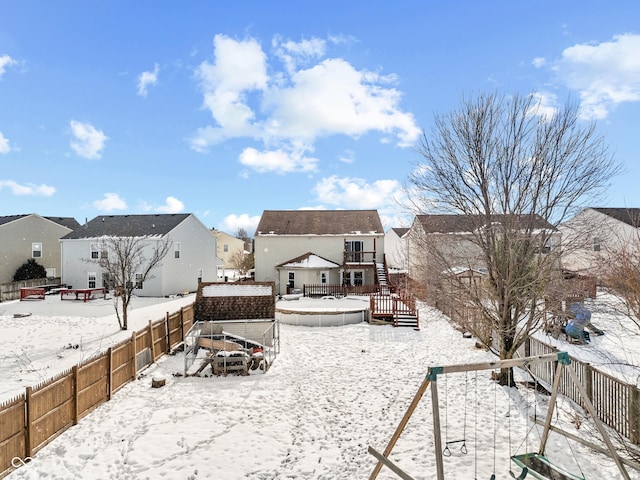 view of yard layered in snow