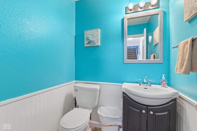 bathroom with toilet and vanity