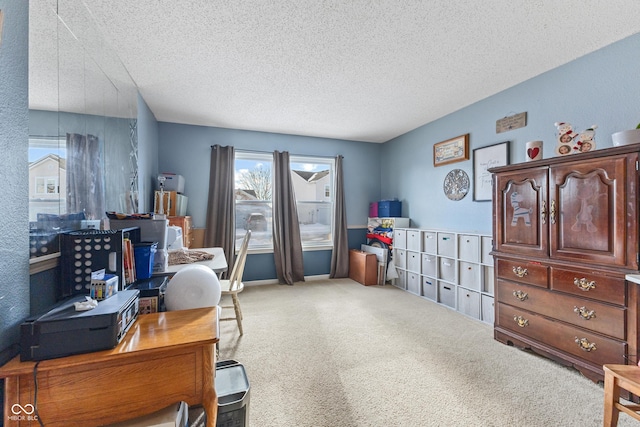 office area with a textured ceiling and carpet floors