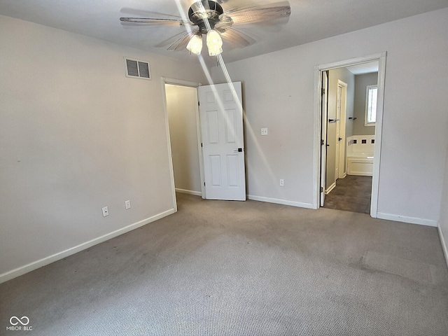 empty room featuring ceiling fan and carpet flooring