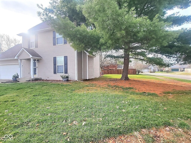 view of home's exterior featuring a yard and a garage