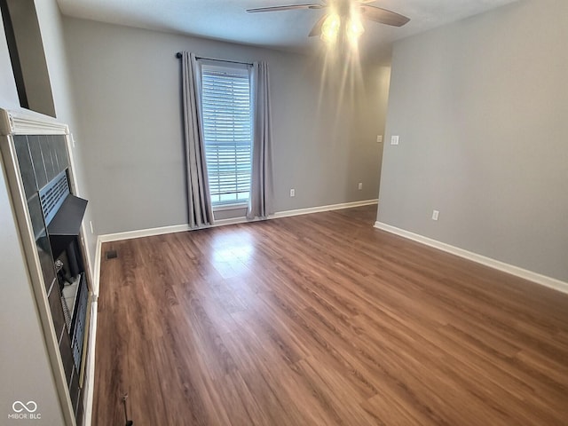 unfurnished living room with ceiling fan and hardwood / wood-style floors