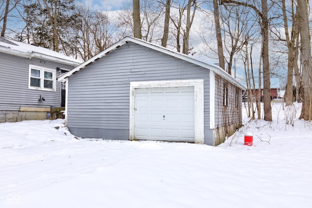 view of snow covered garage