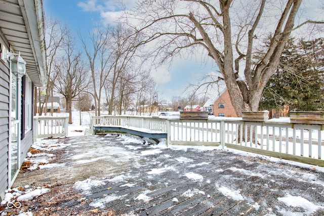 view of snow covered deck