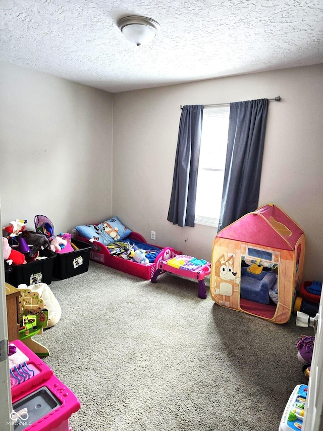 carpeted bedroom with a textured ceiling